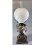 Early 20th Century double oil burner lamp having opaline glass globular shade above a glass