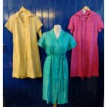 Three vintage 60's/70's brightly coloured silk and silky fabric shirt dresses with belts. (3) (B.