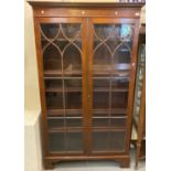 Reproduction mahogany bookcase/display cabinet with two astragal glazed doors and adjustable