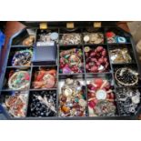 Collection of vintage and other jewellery in mirrored jewellery display case: cameo, watches,