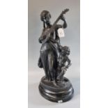 Painted spelter figure group of a lady musician with dancing child. 44inches high approx. On Socle