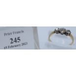 Yellow metal three stone diamond engagement ring. Size O + 1/2. 2.1g approx. (B.P. 21% + VAT)