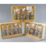 Three boxed sets of Cottrell & Company Flint Edge Gold Alloy solutions, each containing five plastic