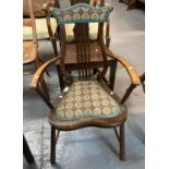 Early 20th century lyre backed side chair with padded back and seat, open arms and tapering tuned