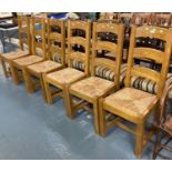 Set of six robust pine ladder back dining chairs with seagrass seats. (6) (B.P. 21% + VAT)