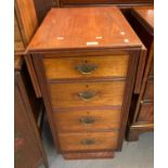 Edwardian pine and mixed woods drop-leaf narrow chest of four drawers, possibly from a desk. (B.P.