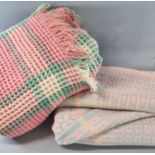 Two vintage woollen blankets or carthen, one is a Welsh tapestry pale pink ground and the other is a
