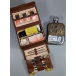 Silver plate and snake skin covered glass hip flask and a small sewing case with accessories and