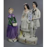 Flatback Staffordshire figurine of a courting couple, together with a Royal Doulton figurine '