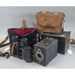 Two vintage box cameras; one in canvas case, one in leather case, together with a pair of Pentax