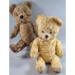 Two vintage Teddy Bears, one with plastic nose, one with stitched nose and canvas pads. The darker