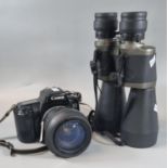 Canon EOS 1000FN SLR camera with Sigma 28 200mm zoom lens. Together with a pair of Traveler 10-30x60