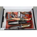 Collection of assorted sheath knives and clasp knives including: Swiss Army knife, theatrical