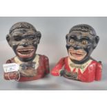 Two similar black man automaton cast metal money boxes, both lacking their bases. 17 and 16cm high