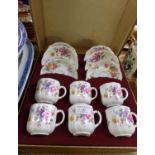 Set of six Royal Crown Derby 'Derby Posies' teacups and saucers in original box, transfer printed