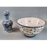 19th Century Delft pottery bowl with floral and stylised decoration. 26cm diameter approx.