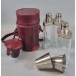 Leather cased three flask travelling set with glass bottles having plated covers, together with a