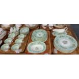 Three trays of Coalport 'Strange Orchid' English bone china dinner and teaware to include: various