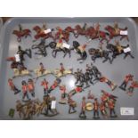 Tray of Britains and other lead military soldiers, some on houseback, some with rifles, drummers