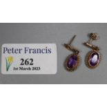 Pair of 9ct gold amethyst set earrings with gadroon framing. 3.2g approx. (B.P. 21% + VAT)