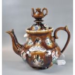 19th Century Measham pottery Bargeware baluster shaped teapot with applied sprigged decoration,