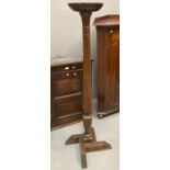 Mahogany torchere stand, from a 19th century bed post now on an angular base with circular top. 24cm