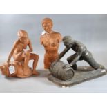 Group of three sculptural ceramic figures: man rolling barrel, standing nude and seated nude
