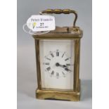 20th Century brass carriage clock with full depth Roman dial and key. 12cm high approx. (B.P.