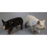 Two Beswick pigs/boars; one dark grey marked 74C. (2) (B.P. 21% + VAT)