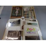 Postcards collection in album and packet, mostly topographical and greetings together with silk hose