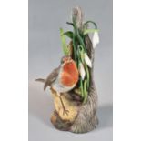 A Boehm porcelain study, robin with snowdrops. Printed marks to base. 20cm high approx. (B.P.
