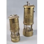 Two unused brass miner's safety lamps, the smaller one baring label 'Ferndale Coal and Mining