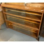 Mid century oak bookcase/display cabinet with glass sliding doors. (B.P. 21% + VAT)