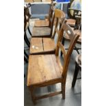 Four 19th century Welsh bar back oak kitchen chairs, one with overhanging top rail, solid seats. (4)