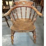 Early 20th century beech and elm smoker's bow armchair with saddle seat and baluster turned legs. (