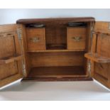 Early 20th century oak two door smoker's cabinet with fitted interior. 36cm wide approx. (B.P. 21% +