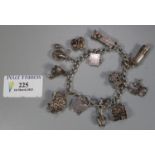 Silver charm bracelet with padlock and various charms. 1.5 troy ozs approx. (B.P. 21% + VAT)