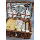 Fully fitted cane/wicker picnic hamper. Together with a Japanese parasol. (2) (B.P. 21% + VAT)