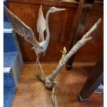 Rustic and weathered metal study of a crane standing on a branch. (B.P. 21% + VAT)