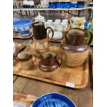 Four Doulton Lambeth stoneware items, to include: two baluster topers/harvest jugs, a conical