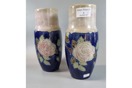 Pair of late 19th century Royal Doulton stoneware baluster vases overall on a blue ground with