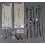 A collection of silver jewellery including five identity bracelets, two chains, silver cufflinks