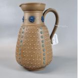 Doulton Lambeth Silicon stoneware single handled jug of tapering form with moulded flowerheads to