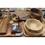 Two trays of assorted treen, to include: two rustic bread flats, elm turned bowls, an olive wood