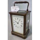 Large brass carriage clock with full depth Roman dial and repeat movement striking on one bell. 15cm