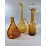 Three mid century amber glass items, to include: conical shaped decanter/carafe with moulder roundel
