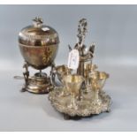 Silver plated egg cruet set on a naturalistic repousse decorated organic base together with a silver