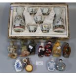 Box comprising Oriental porcelain glass and other snuff bottles with stoppers, carved figures etc.