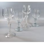 Pair of large hock/wine glasses with air twist stems on circular base together with two baluster