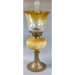 Early 20th century double oil burner lamp having clear and yellow etched shade above a ceramic